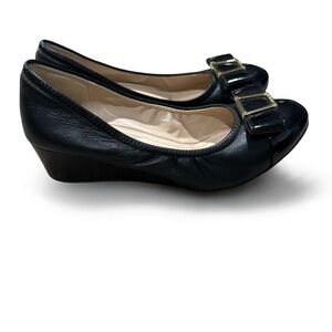 Cole Haan Black Leather Wedge Heel with Bow and Gold Hardware. Women’s size 6.
